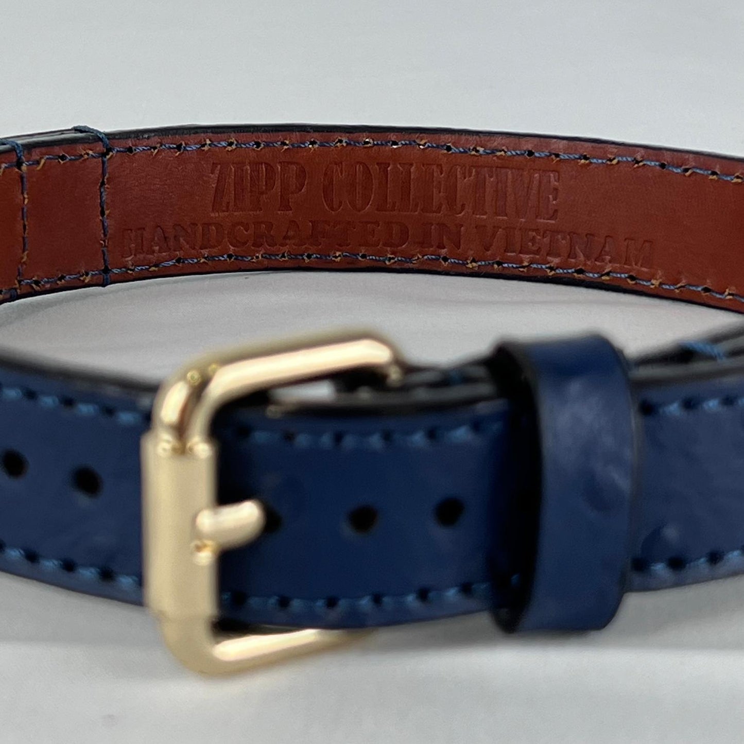 Deep red leather lining with ZIPP COLLECTIVE branding