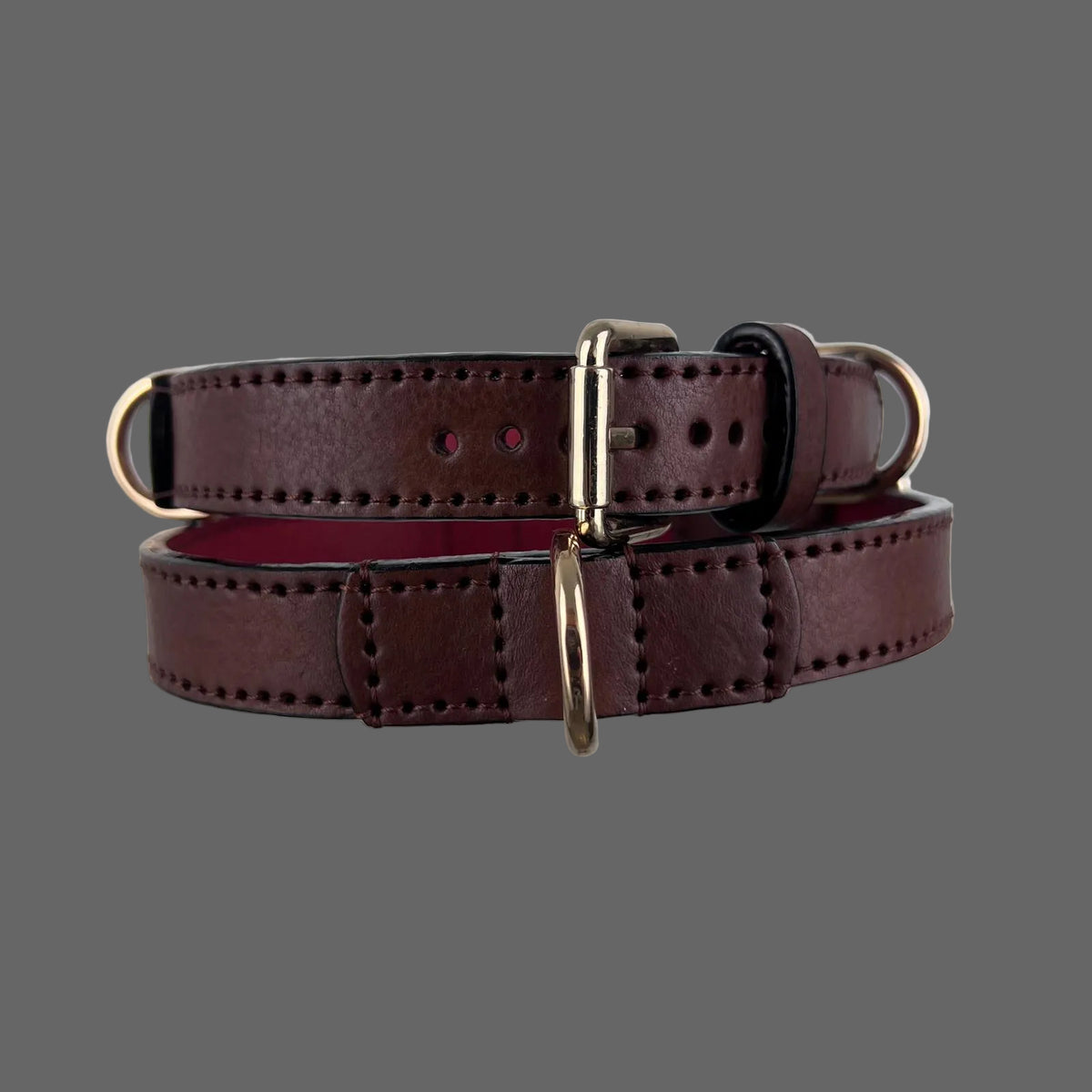 Rear view of dark brown leather dog collars showing hand stitching and red leather lining
