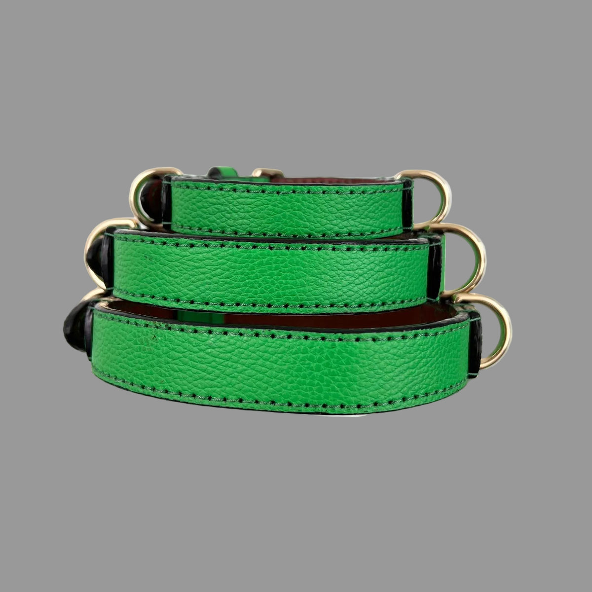Three sizes of bright green handmade leather dog collars