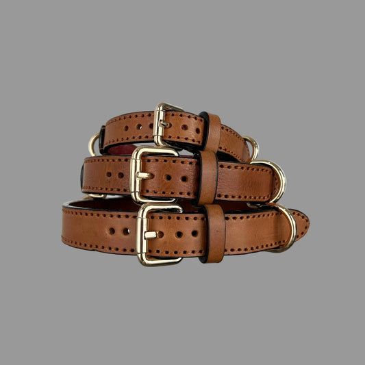 M, L and XL saddle brown collars showing cowhide grain, dark edges and red lining inside the M collar.