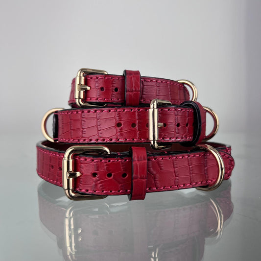 Deep ruby red crocodile-embossed leather dog collars in sizes M, L and XL