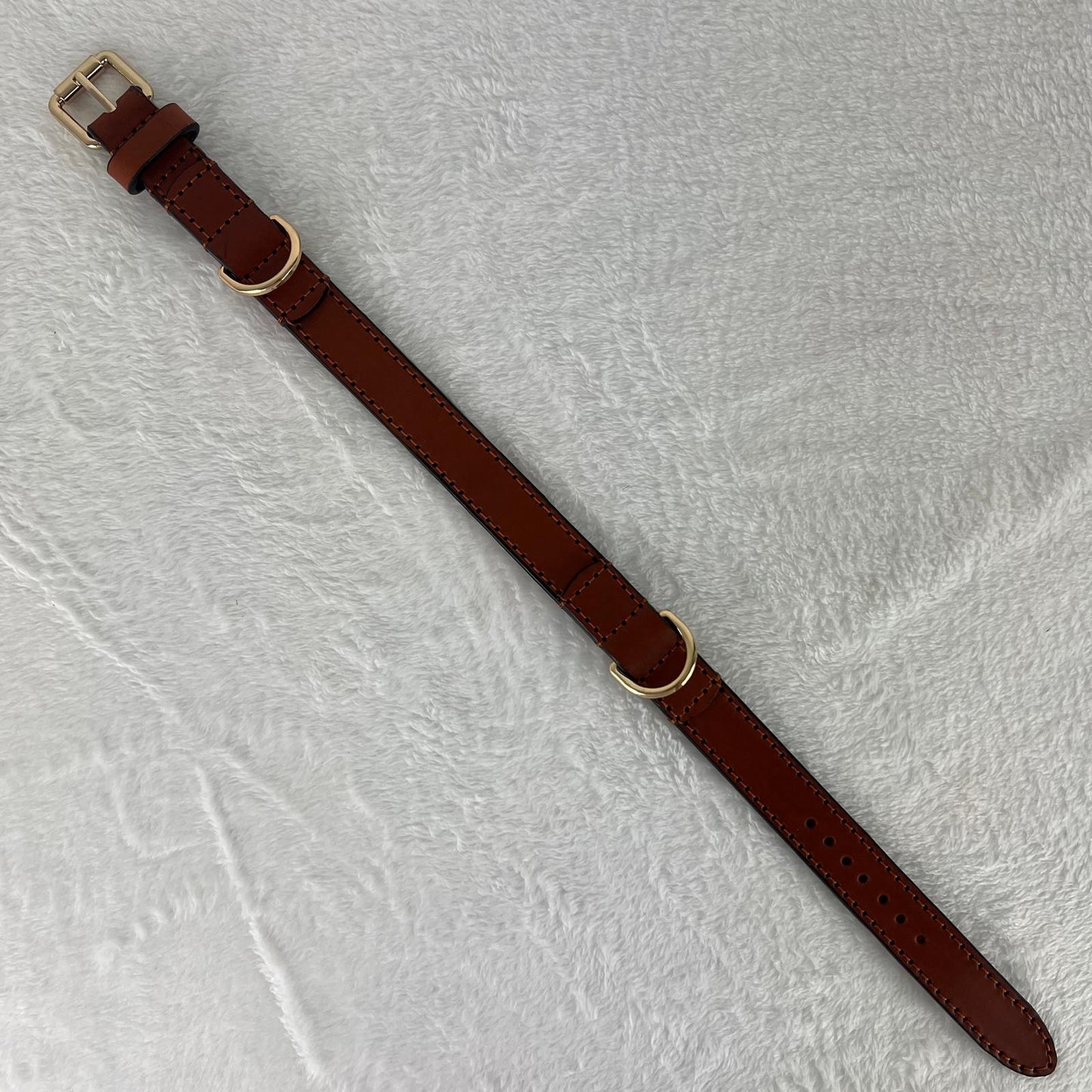 Full-length cognac brown full-grain leather dog collar with black-finished edges and double D-rings